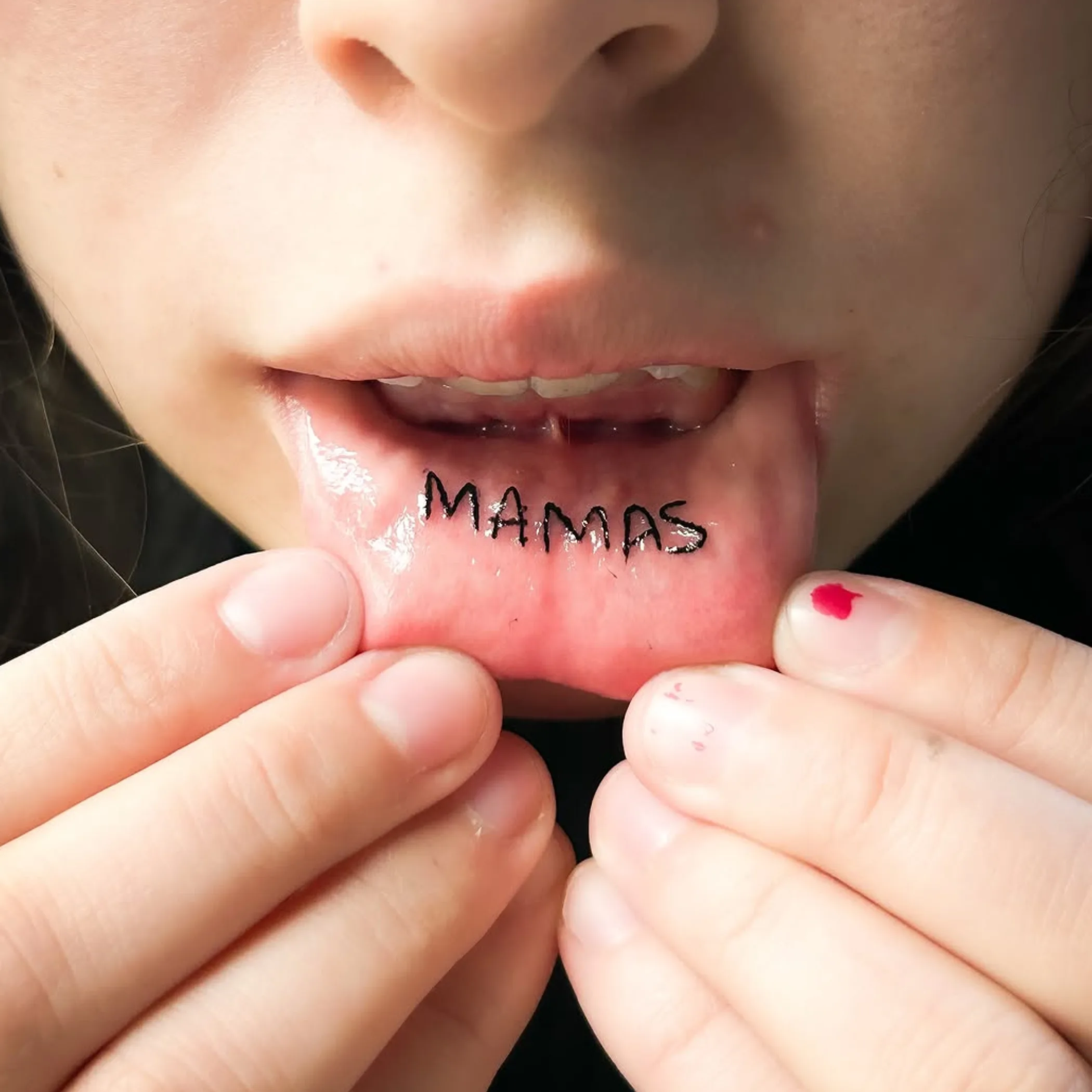 close-up of lip tattoo on lips