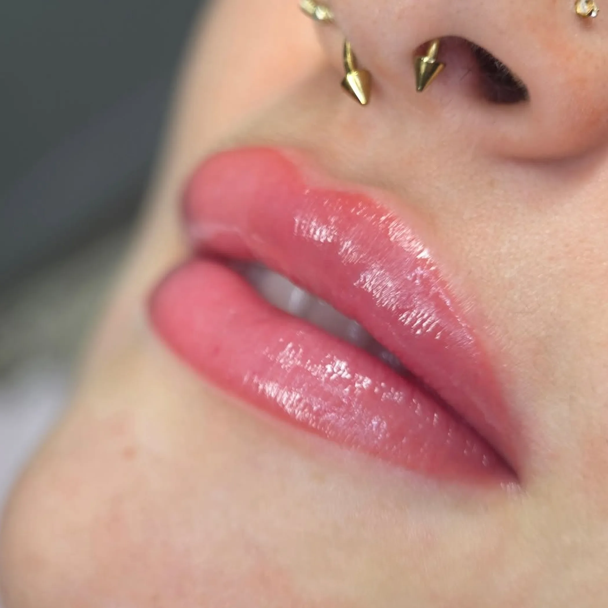 close-up of lips with lip tattoo
